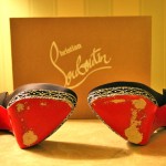 Christian Louboutin red soled worn shoes