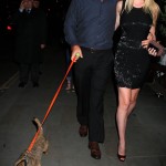 Lara Stone with husband and their dog