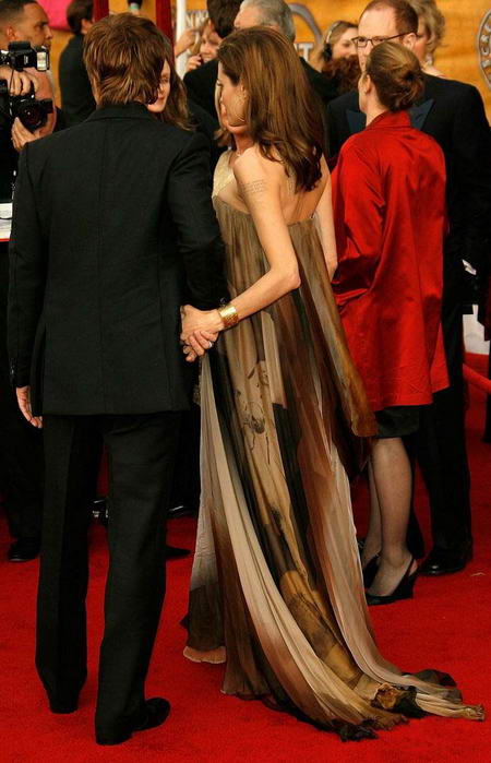 angelina jolie red carpet dresses. Angelina Jolie and Brad Pitt