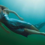 Charlize Theron swimming for Vogue