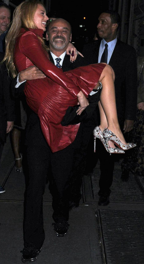 Christian Louboutin carries Blake Lively in his arms