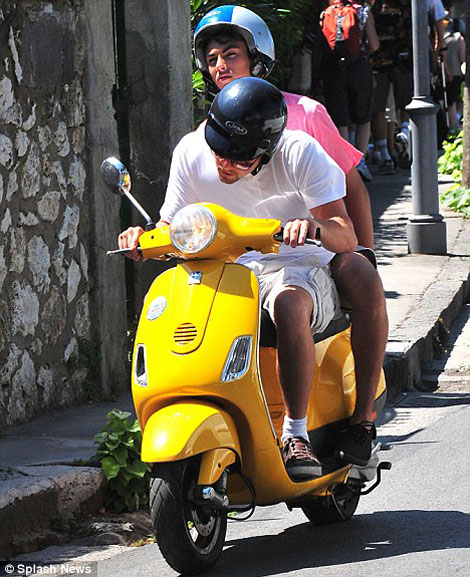 Leonardo Di Caprio yellow scooter