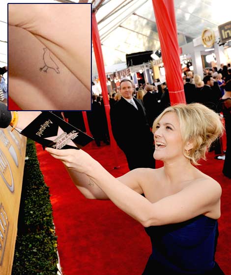 Drew Barrymore right arm bird tattoo
