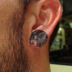 Ear lobe tattoo