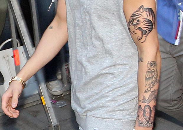 Justin Bieber growing tattoos collection
