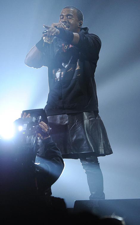 12.12.12. Concert: Kanye Wears Skirt On Stage