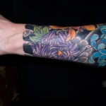 Stefano Pilati Floral arm tattoo